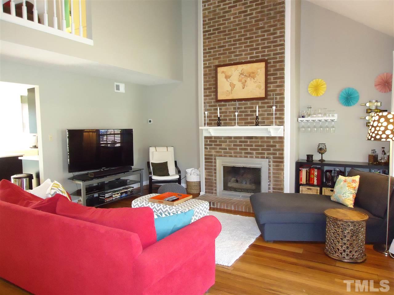 3616 Wickersham Way Raleigh, NC 27604 - Photo 3 of 23 a living room with furniture and a flat screen tv