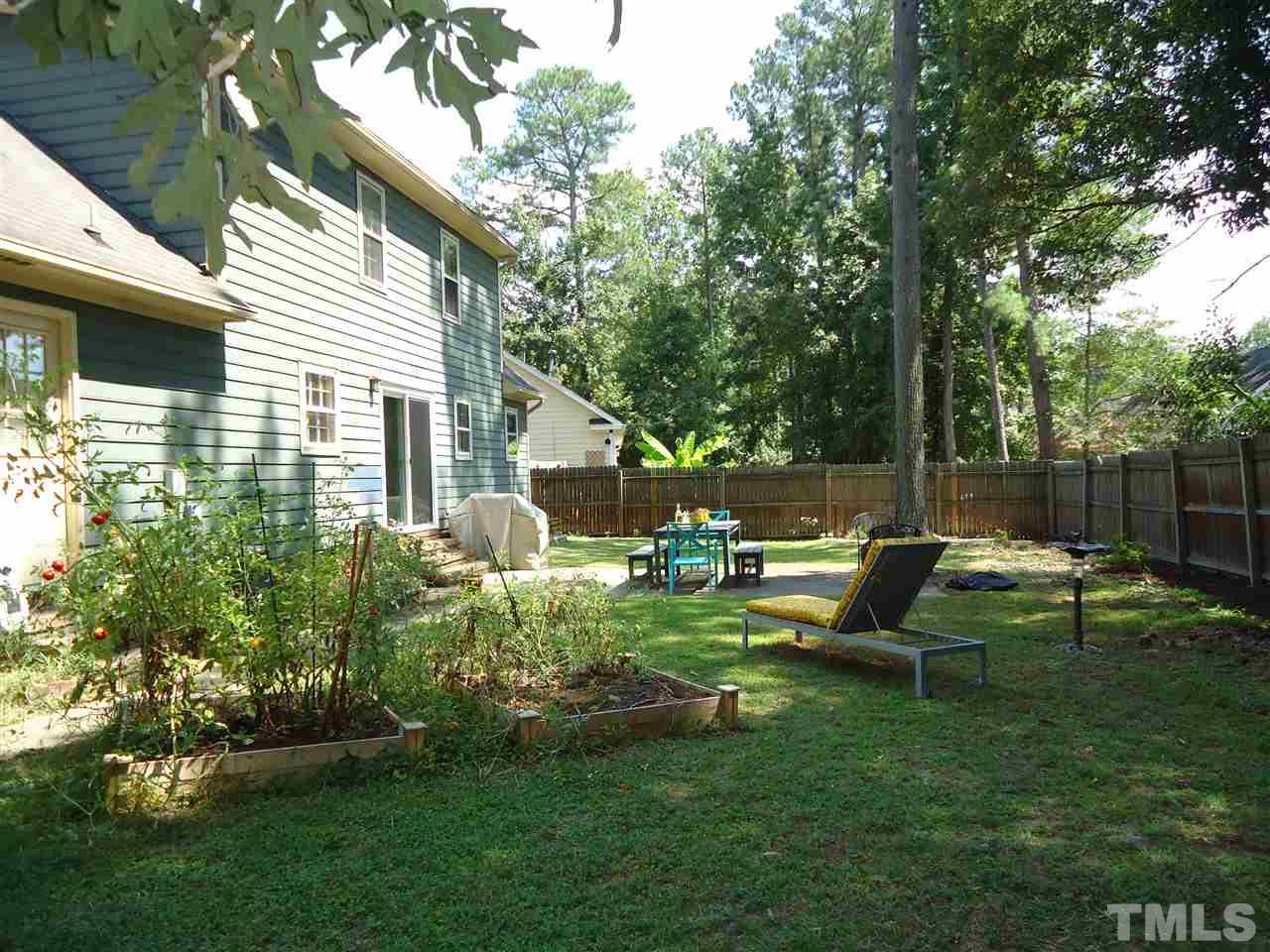 3616 Wickersham Way Raleigh, NC 27604 - Photo 22 of 23 a backyard of a house with table and chairs