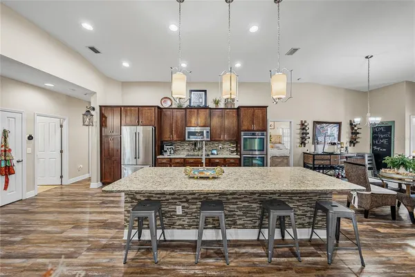 a view of a livingroom with furniture and a ceiling fan