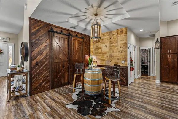 a bathroom with a tub a sink and a large mirror