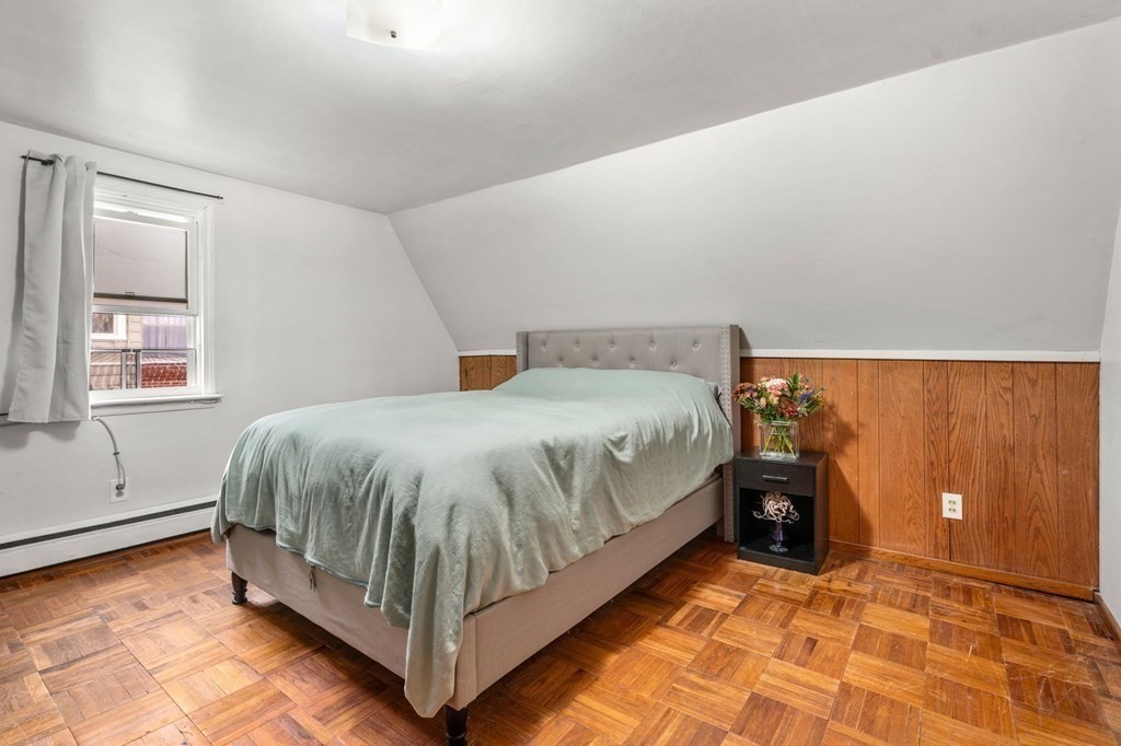 7 Bellvista Road Worcester, MA 01602 - Photo 8 of 20 a bed sitting in a bedroom next to a window