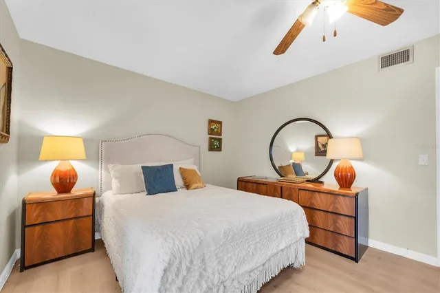 a bedroom with bed and a window