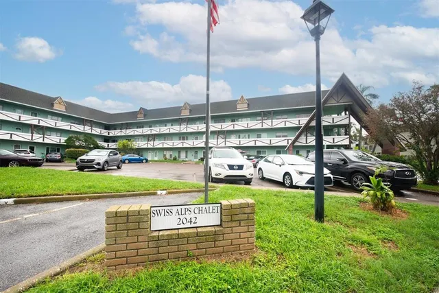 a front view of a building with garden