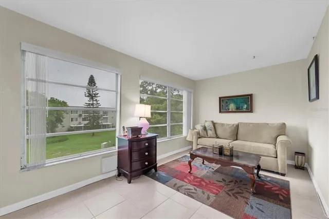 a living room with furniture and a window