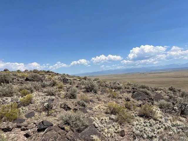 a view of an ocean and a mountain