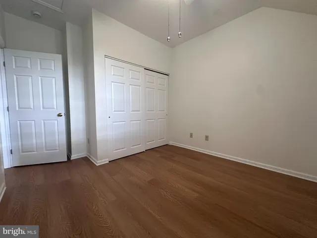 an empty room with wooden floor