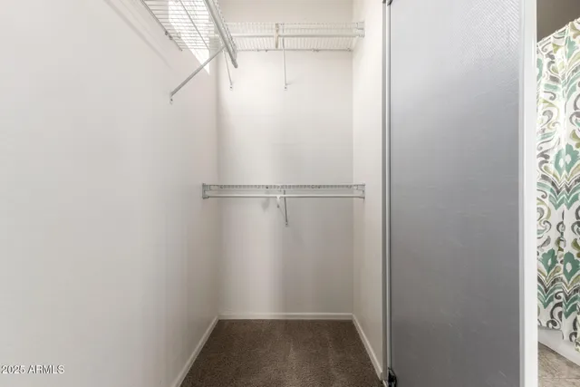 a view of an empty room with glass door