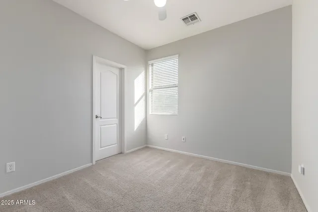 a white toilet sitting next to a bath tub