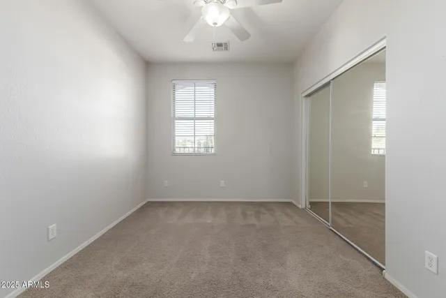a view of a chair and tables in the patio