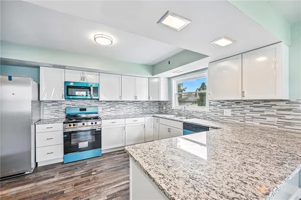 a view of a kitchen with a window
