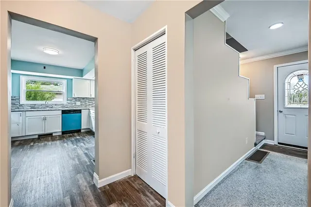 an empty room with floor to ceiling window