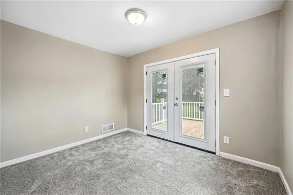 an empty room with a large window