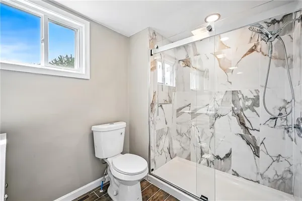 a view of entryway with wooden floor and stairs