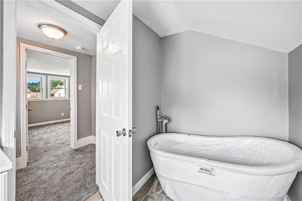 a white toilet sitting next to a bathroom sink