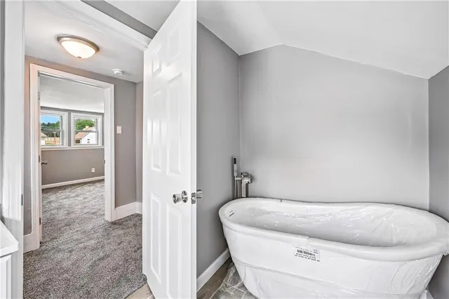 a white toilet sitting next to a bathroom sink