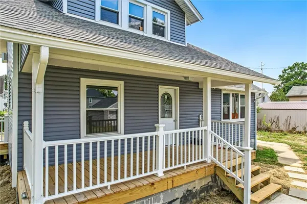 a view of a house with a small yard