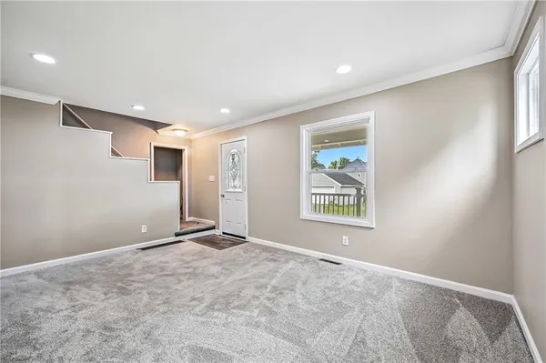 a view of an empty room with a window