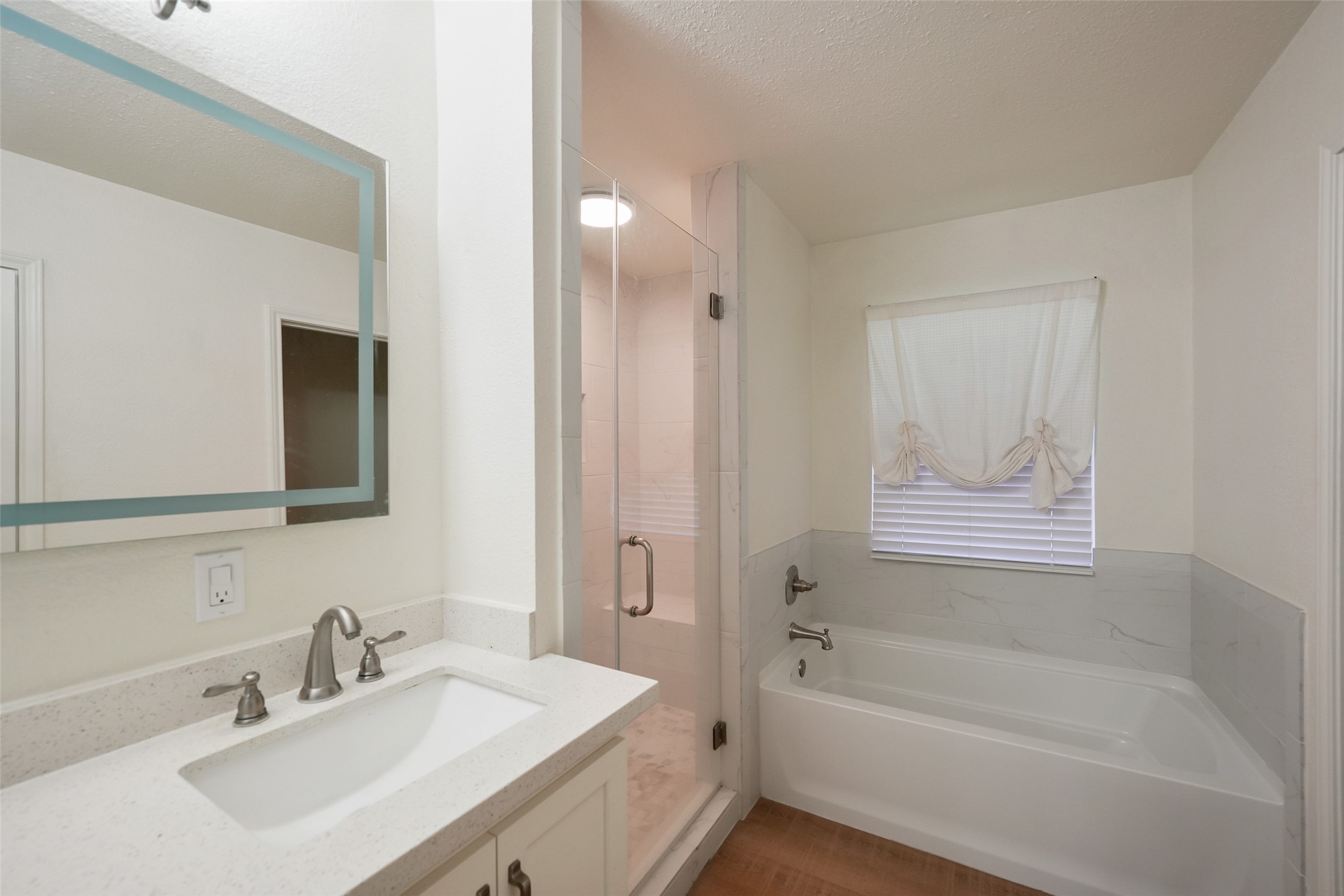 19635 Kermier Road Waller, TX 77484 - Photo 20 of 27 Additional full bathroom with vanity and tub/shower combination for family or guests.