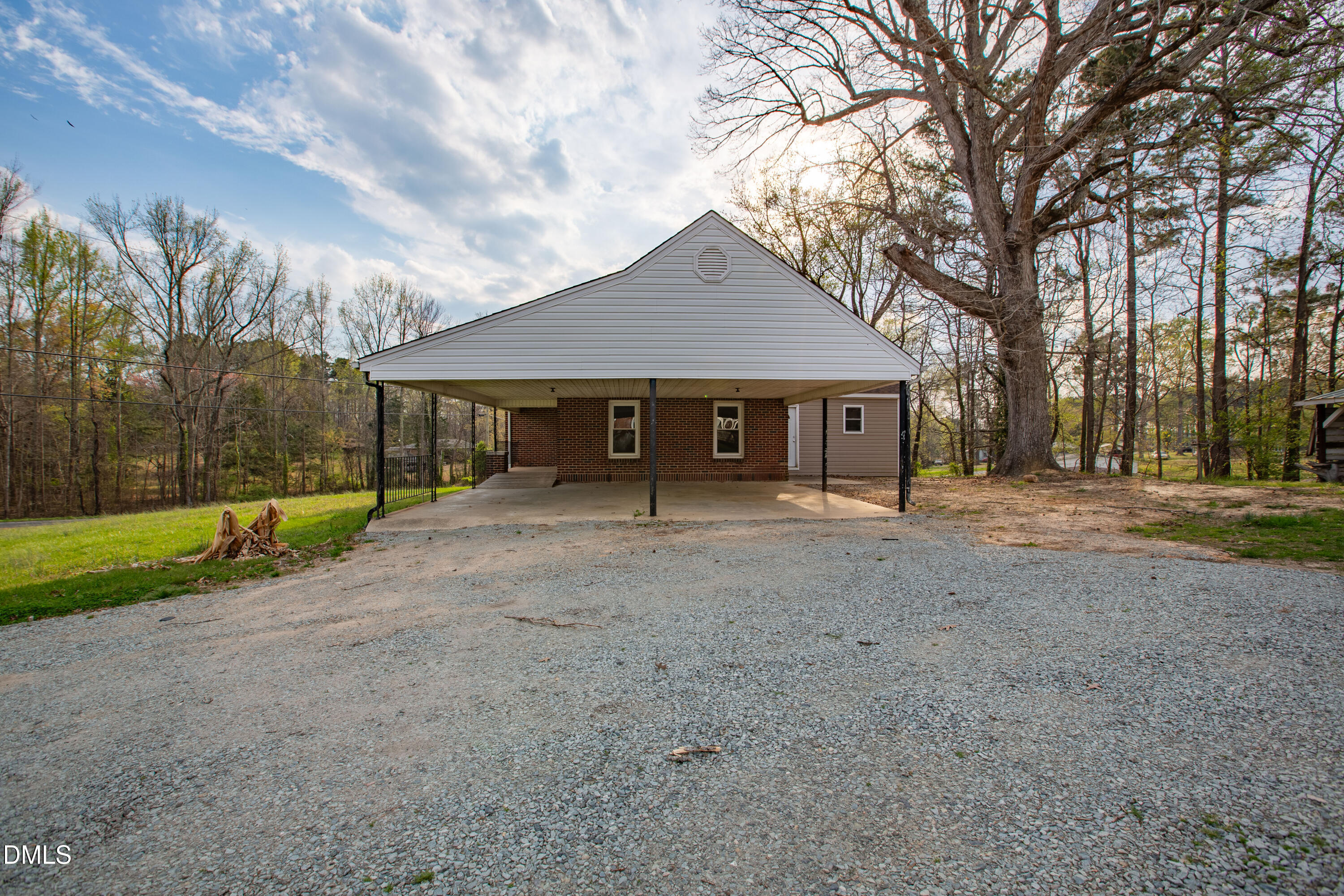 4295 Virgilina Road Roxboro, NC 27574 - Photo 33 of 46 a view of a house with backyard and a tree