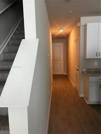 a view of hallway with washer and dryer
