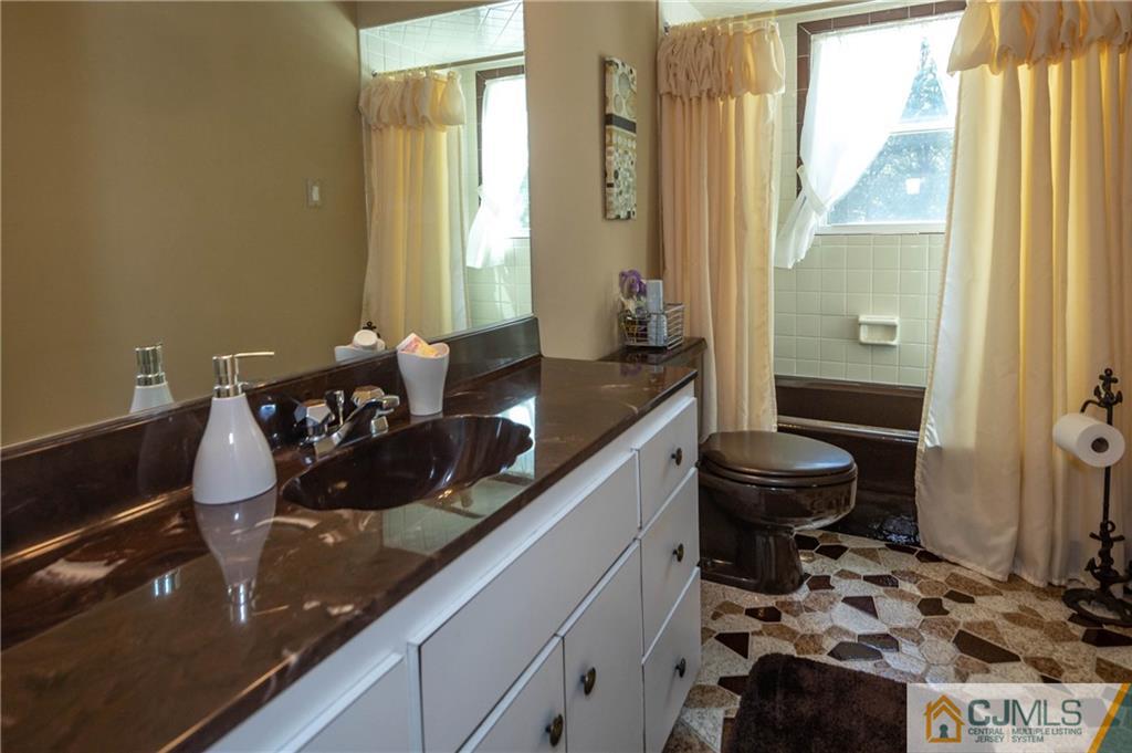 32 Colburn Road East Brunswick, NJ 08816 - Photo 28 of 40 a kitchen with a sink and a stove top oven