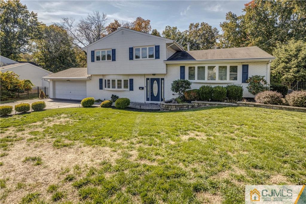 32 Colburn Road East Brunswick, NJ 08816 - Photo 3 of 40 a front view of a house with garden