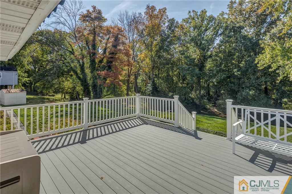 32 Colburn Road East Brunswick, NJ 08816 - Photo 32 of 40 a view of deck with wooden floor and fence
