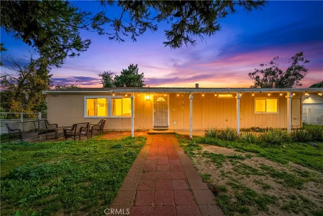 a view of a swimming pool with an outdoor space and seating area