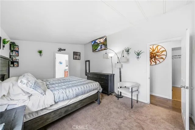 a bedroom with a bed and a table in it