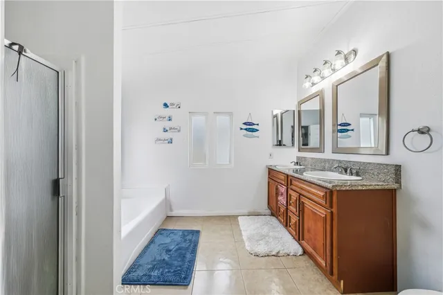 a kitchen with stainless steel appliances granite countertop a stove and a refrigerator