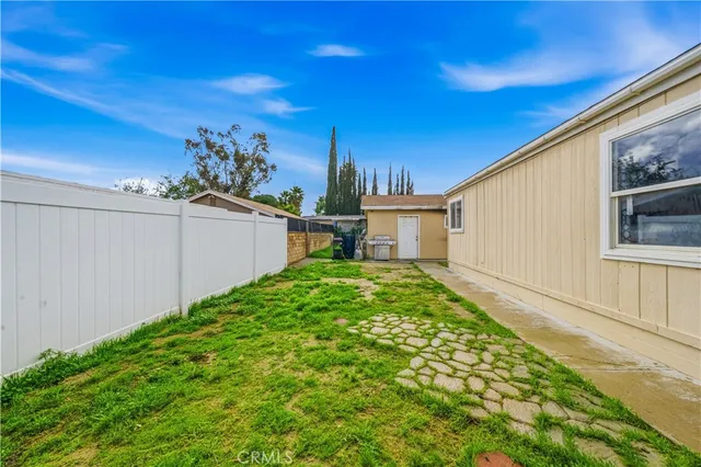 a view of a backyard with plants