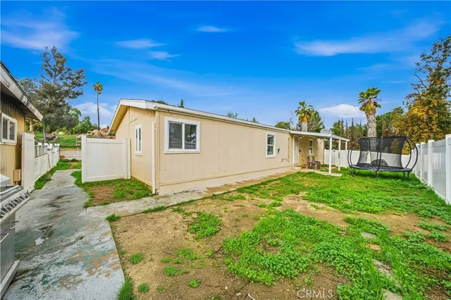 a view of a backyard of the house