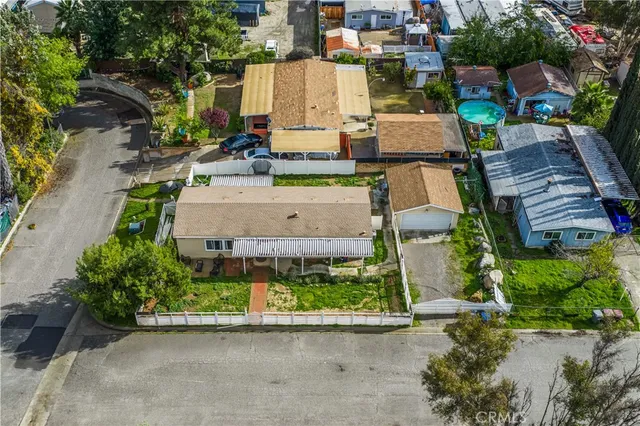 an aerial view of a houses with outdoor space