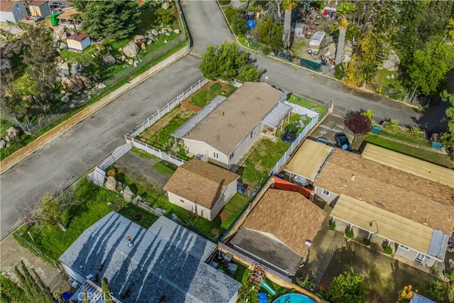 an aerial view of a house with outdoor space