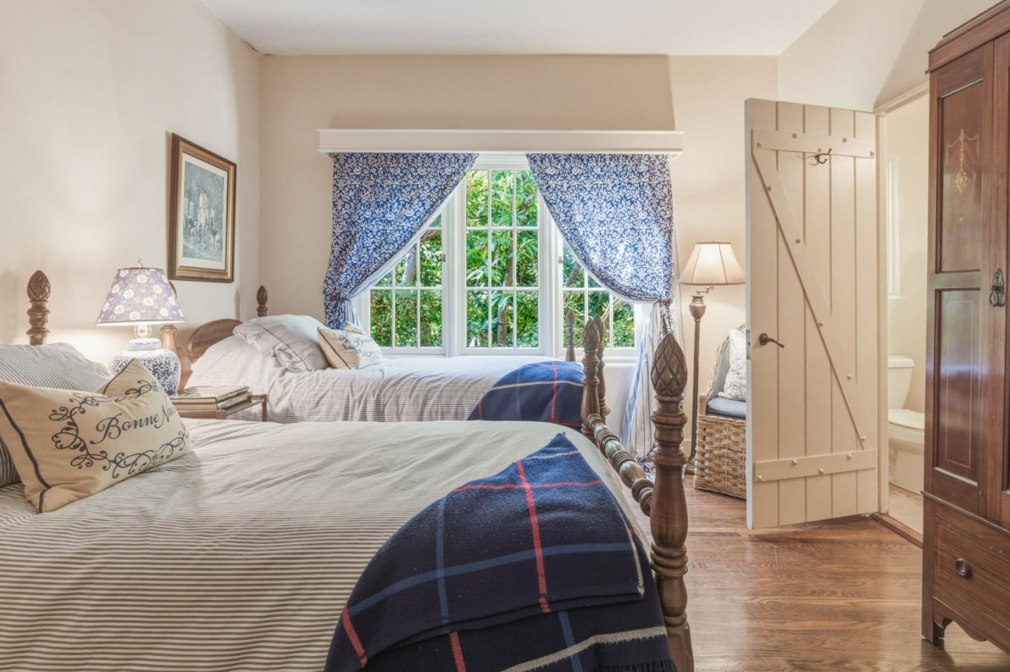 25286 Hatton Road Carmel, CA 93923 - Photo 18 of 34 a bedroom with a large bed and a large window