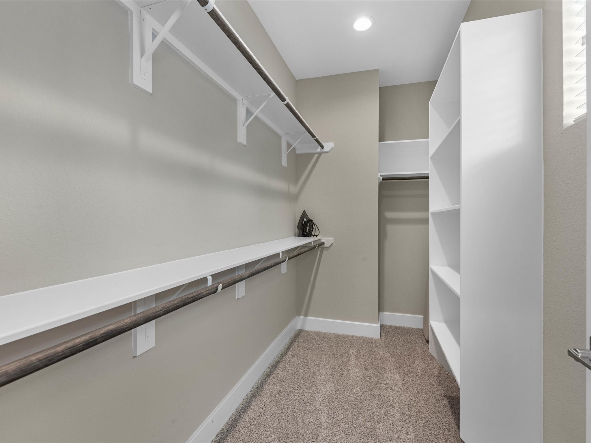 8311 Brecha Lane Houston, TX 77055 - Photo 11 of 19 a view of walk in closet with empty racks