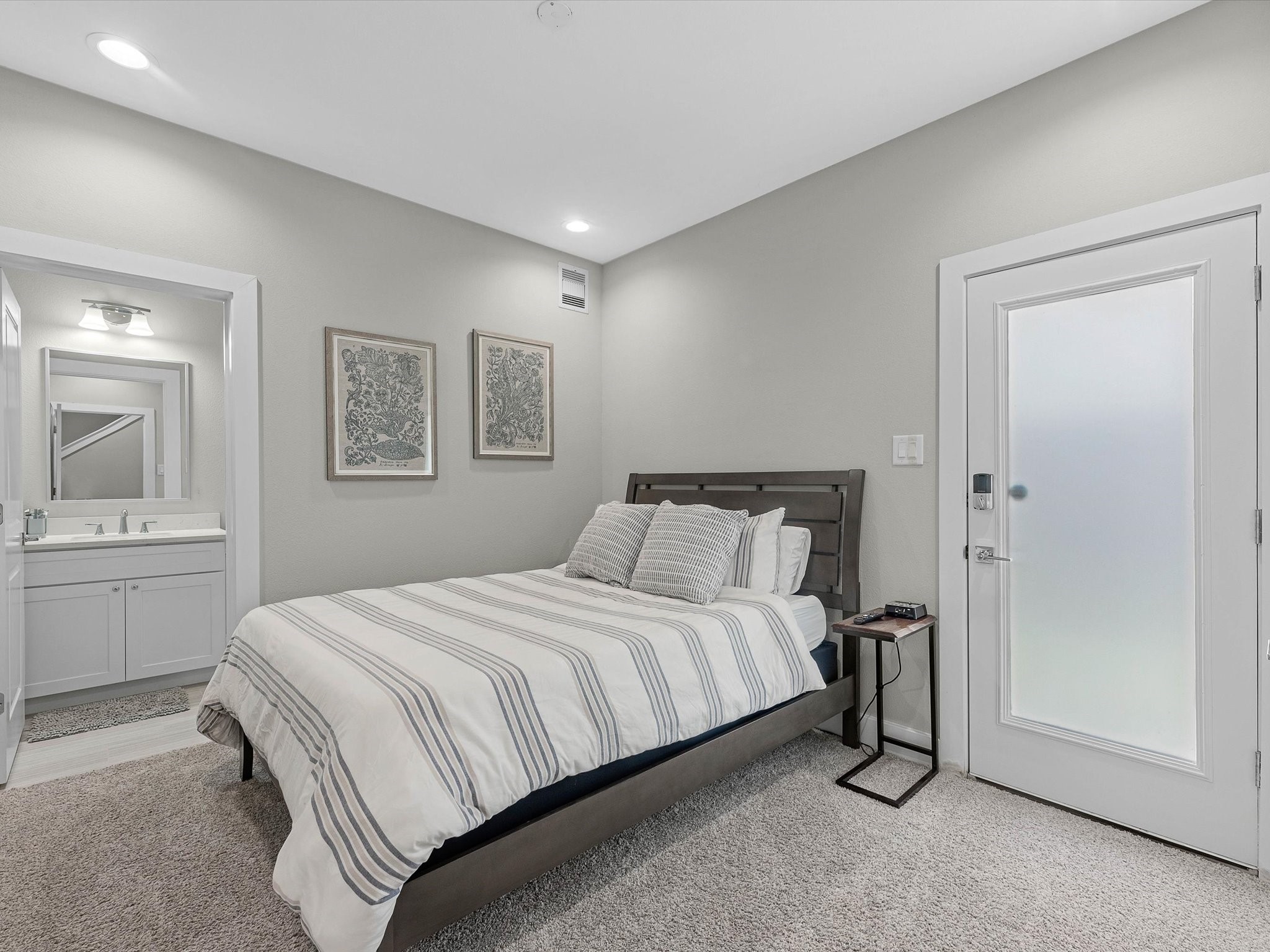 8311 Brecha Lane Houston, TX 77055 - Photo 12 of 19 a bedroom with a bed and a table