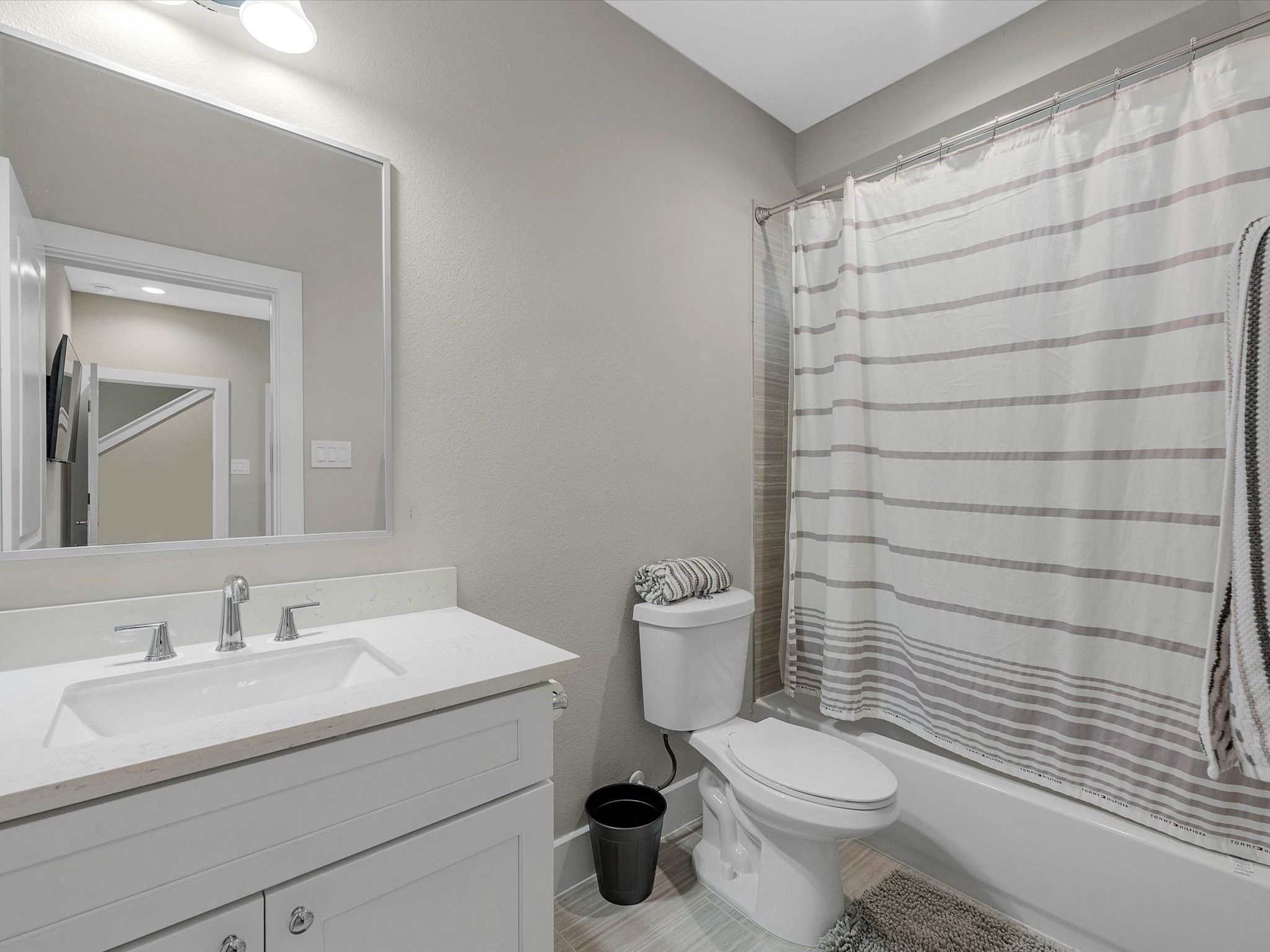 8311 Brecha Lane Houston, TX 77055 - Photo 13 of 19 a bathroom with a sink a toilet and shower