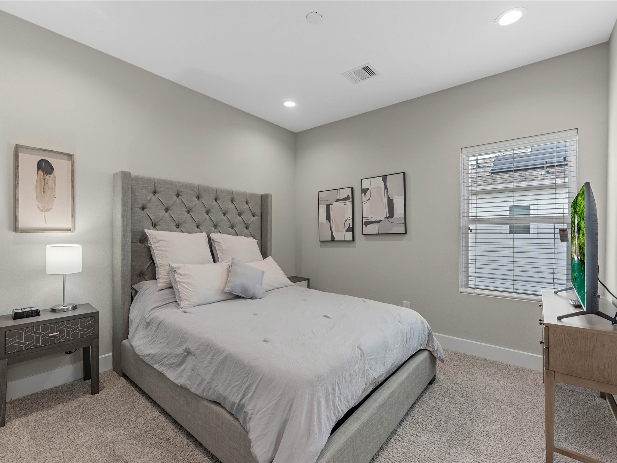 8311 Brecha Lane Houston, TX 77055 - Photo 14 of 19 a bedroom with a large bed and a window