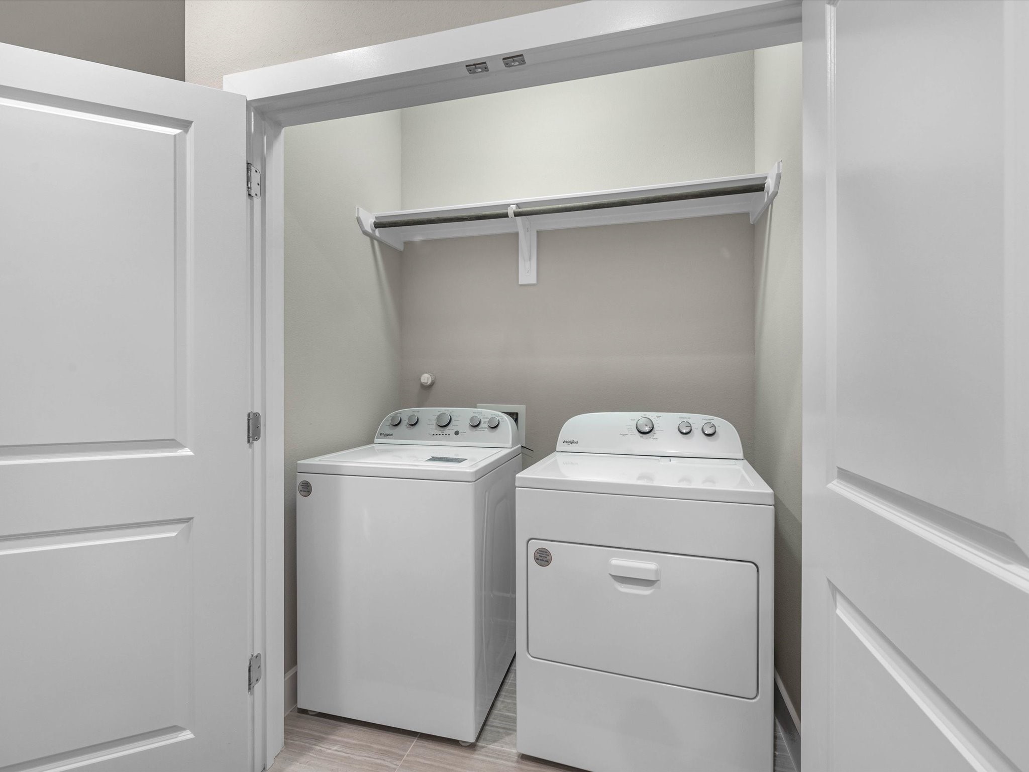 8311 Brecha Lane Houston, TX 77055 - Photo 16 of 19 a utility room with dryer and washer