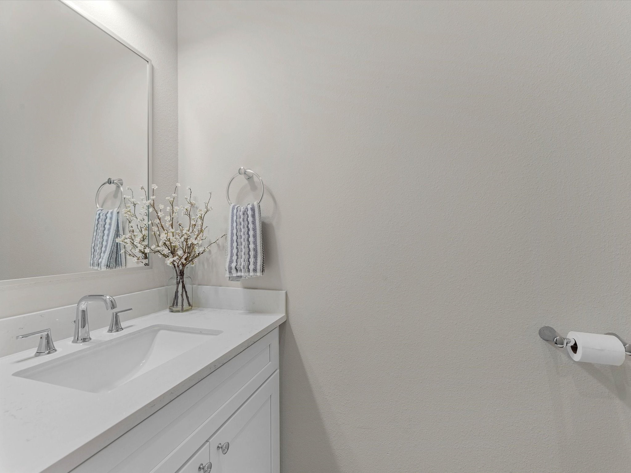 8311 Brecha Lane Houston, TX 77055 - Photo 17 of 19 a bathroom with a sink and a mirror