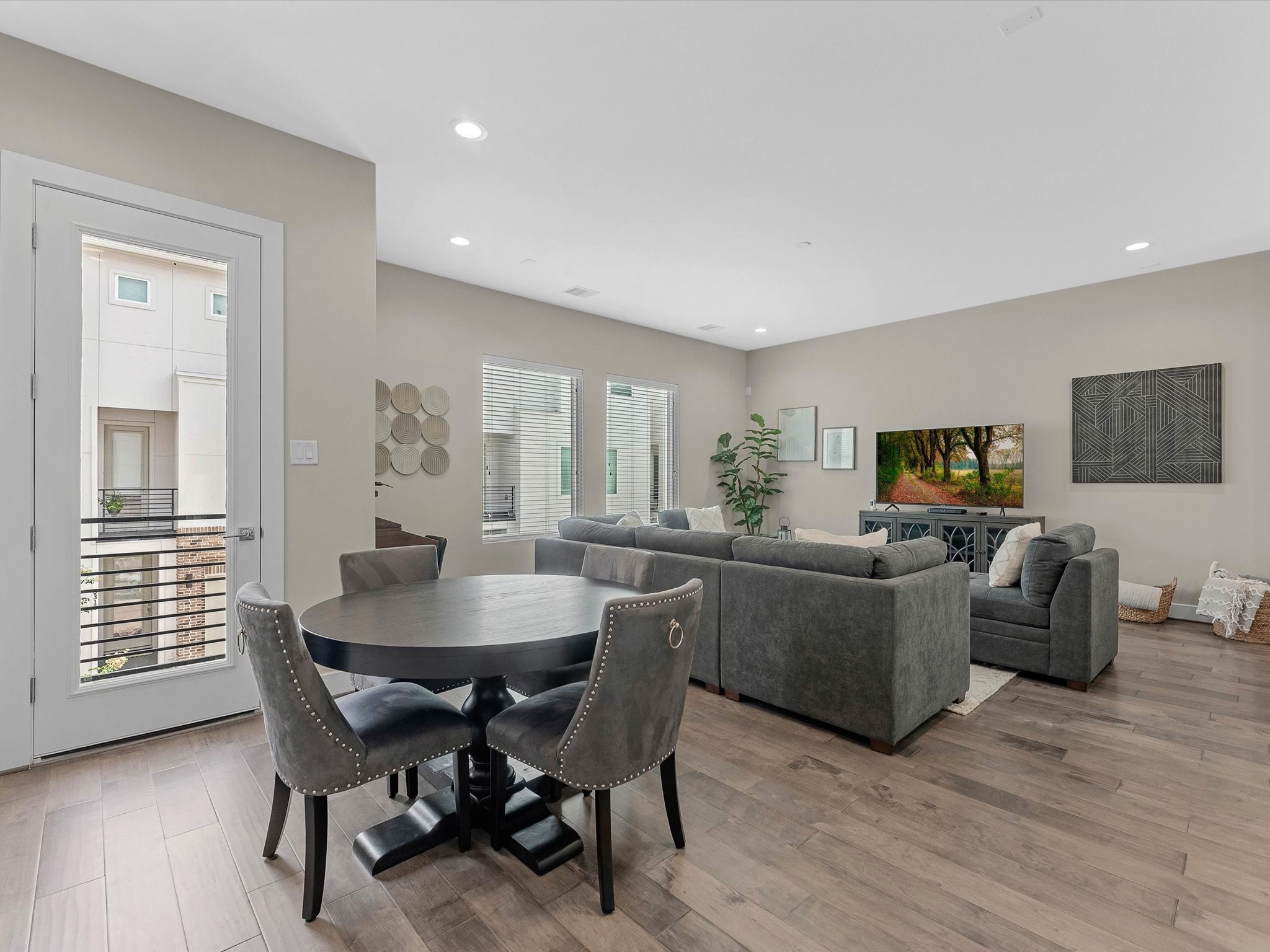 8311 Brecha Lane Houston, TX 77055 - Photo 8 of 19 a view of a dining room with furniture and wooden floor