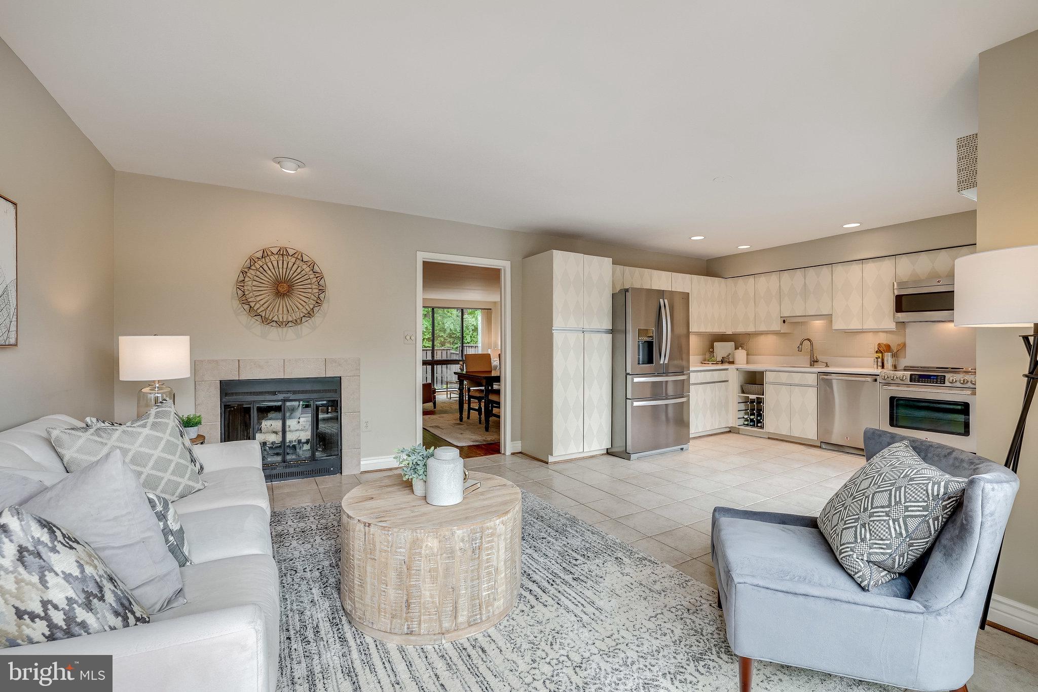 2024 Lakebreeze Way Reston, VA 20191 - Photo 20 of 95 a living room with furniture and a fireplace