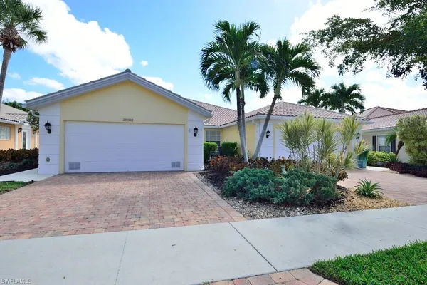 a front view of house with yard and green space