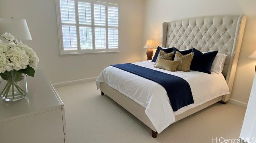 92-1037 Koio Drive, Unit M11 Kapolei, HI 96707 - Photo 6 of 11 a bedroom with a bed and a window