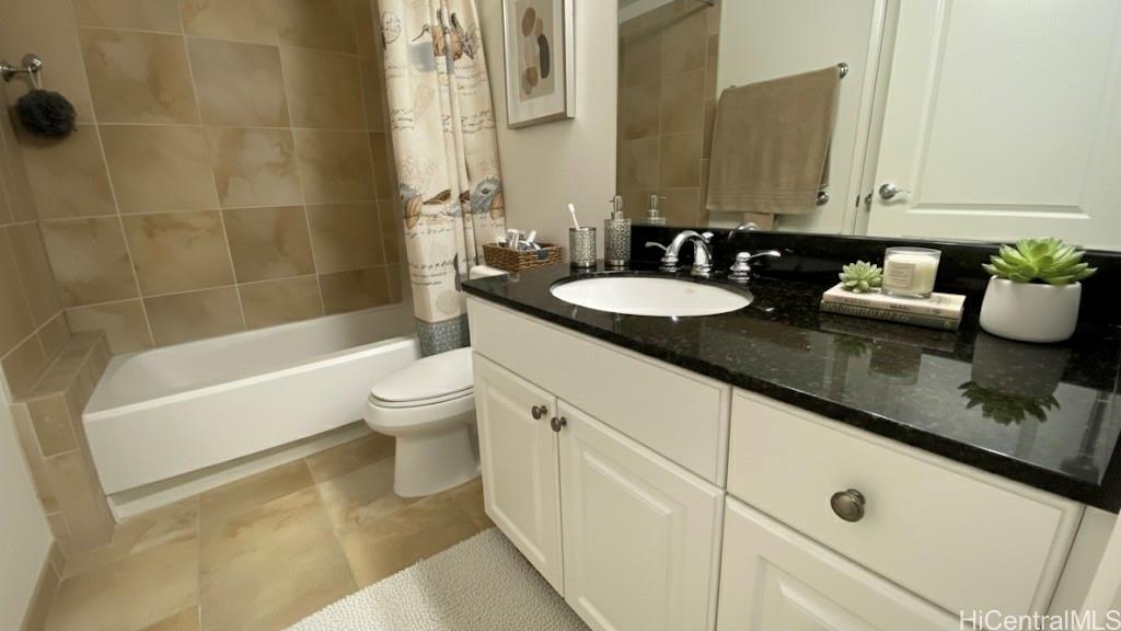 92-1037 Koio Drive, Unit M11 Kapolei, HI 96707 - Photo 9 of 11 a bathroom with a granite countertop bathtub sink vanity mirror and toilet