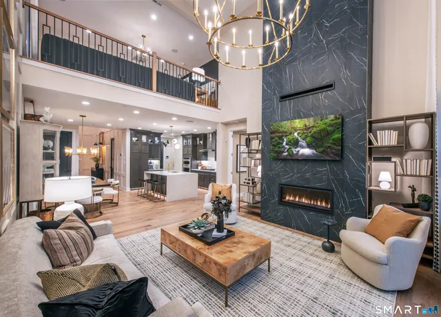 a living room with furniture and a fireplace
