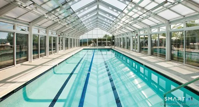 a view of swimming pool with a patio