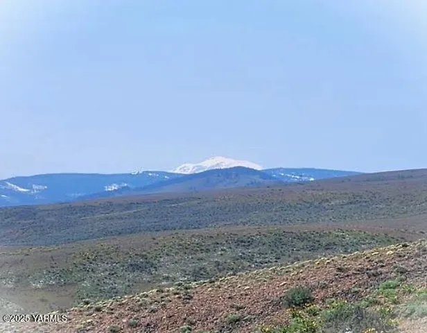 a view of an outdoor space with mountain view