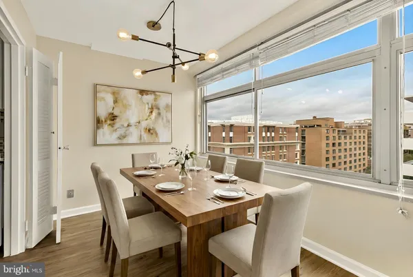 a view of a dining room with furniture window and wooden floor